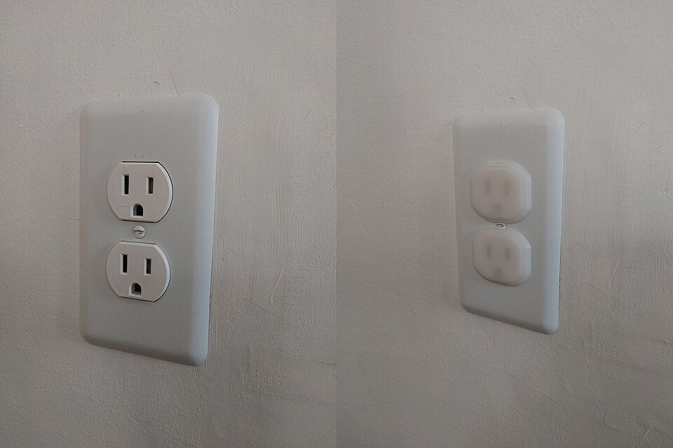 Standard wall outlet shown uncovered and with white plug-in child safety outlet covers
